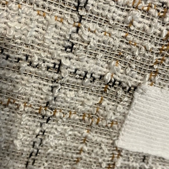 Short sleeved top with a woven style pattern in black, tan, white. - Picture 3 of 5